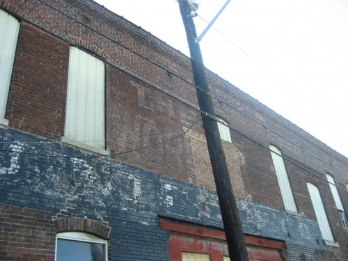 World Furniture before the building was covered with siding